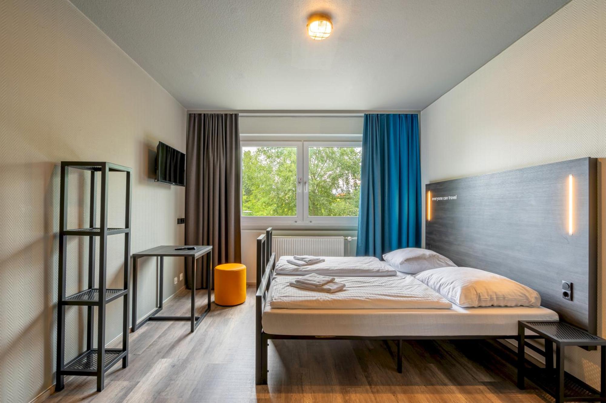 Kamer met twee aparte bedden voor eenpersoonsgebruik