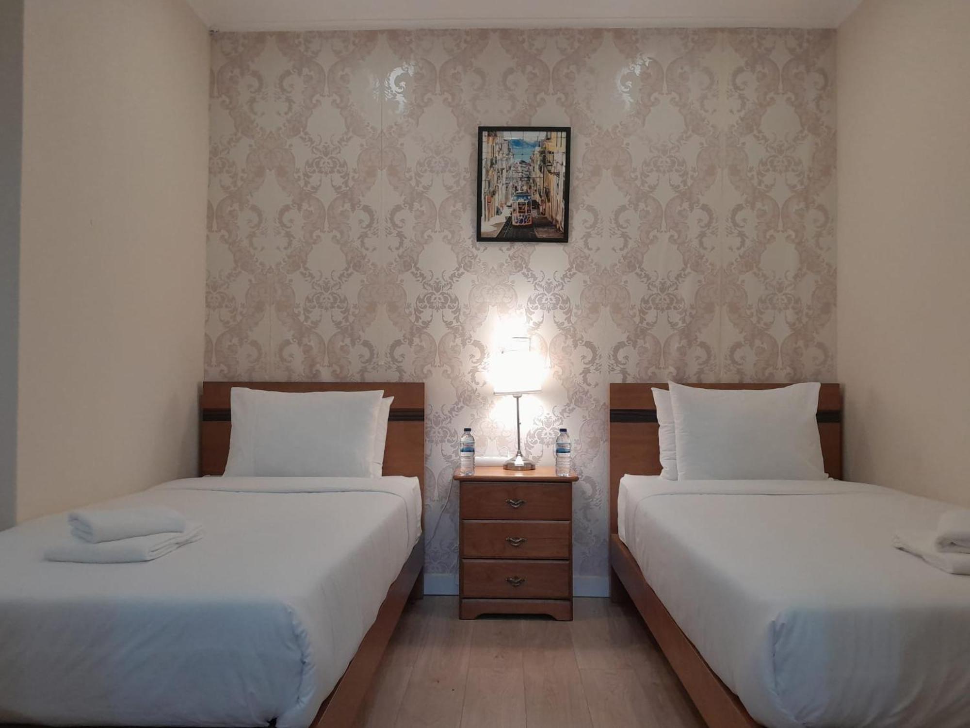 Quarto Twin com Casa de Banho Partilhada