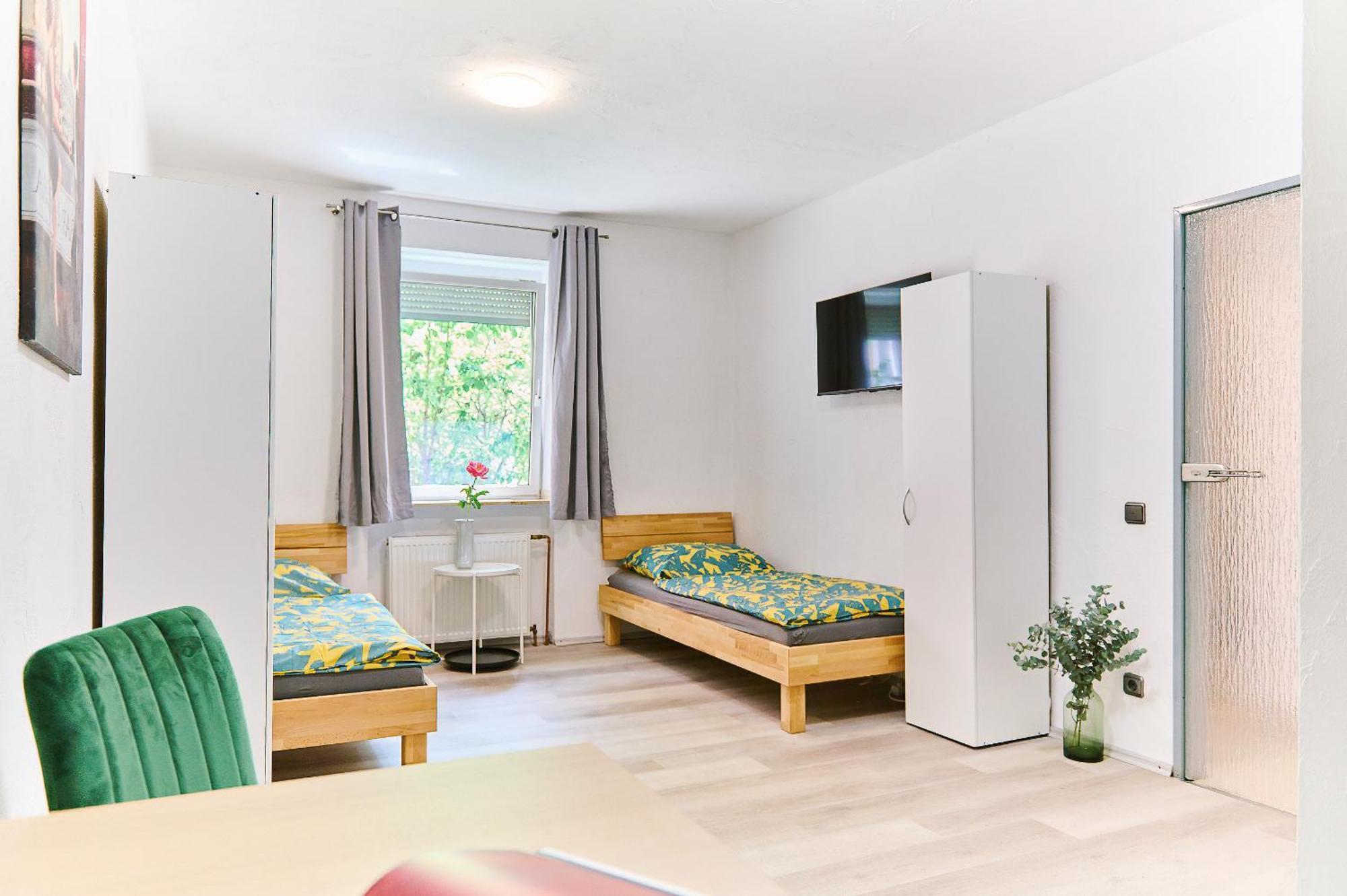Dreibettzimmer mit Gemeinschaftsbad