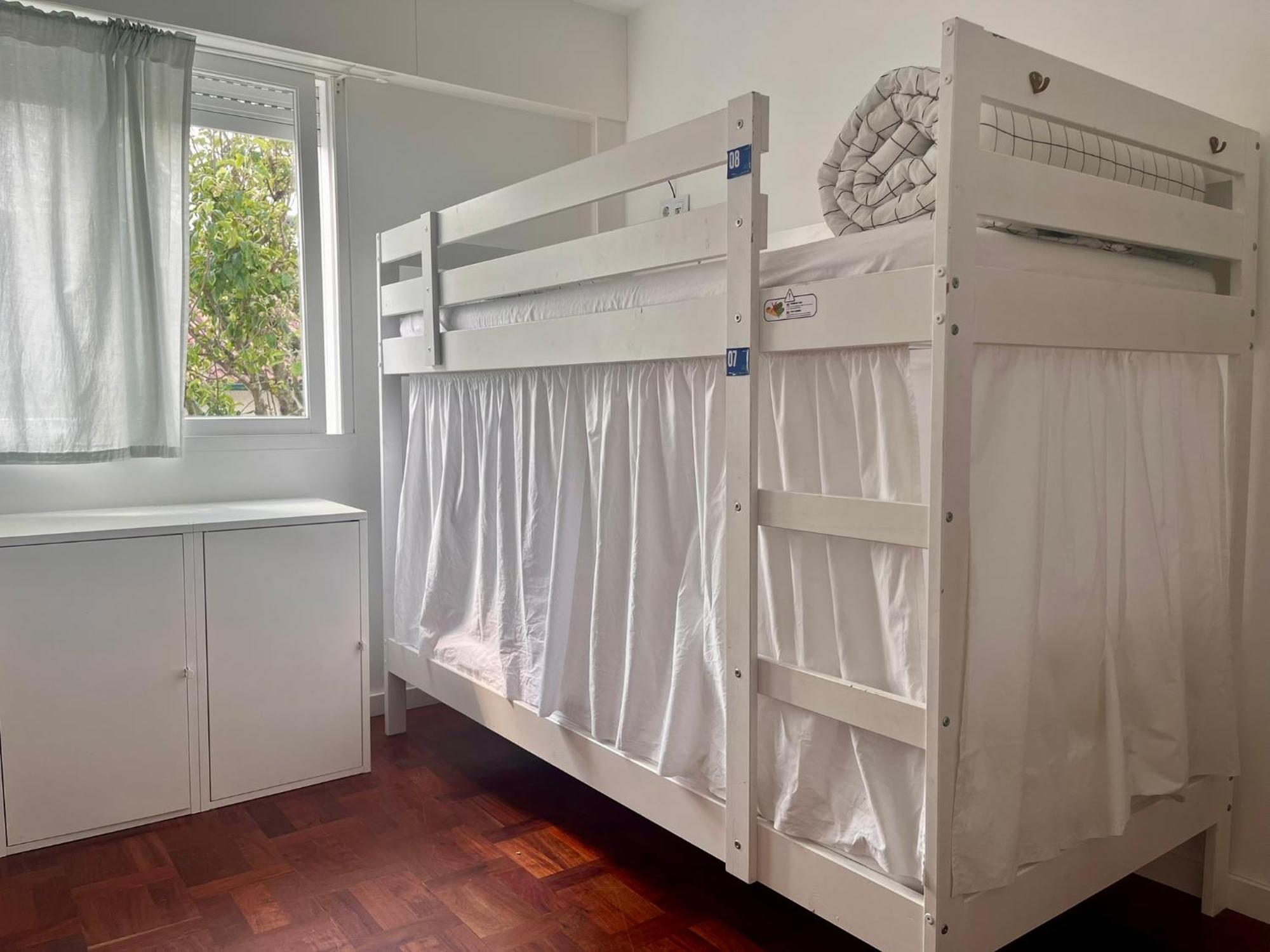 Cama em Beliche num Dormitório Misto