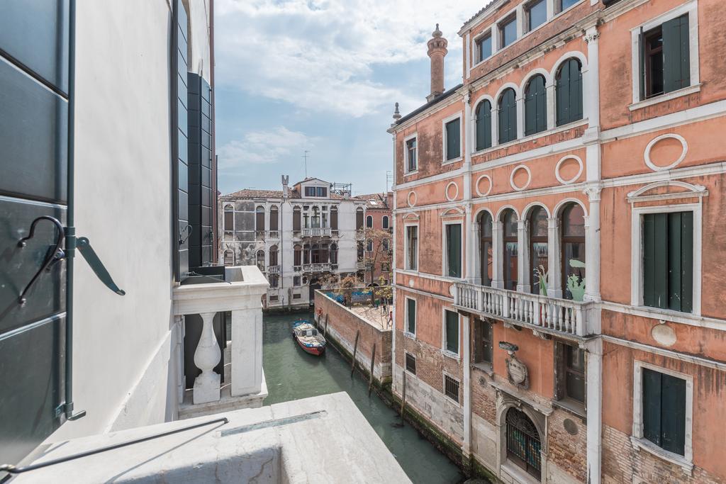 Luxury Three-Bedroom Apartment with Balcony and Canal View